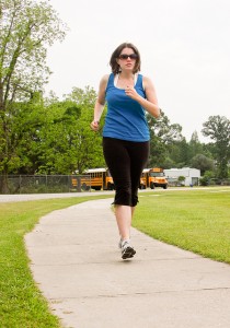 lady jogging on sidewalk